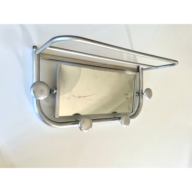 French mid century coat rack with adjustable mirror, 4 hooks and shelf in a late Deco / Bauhaus style, dating from the mid...