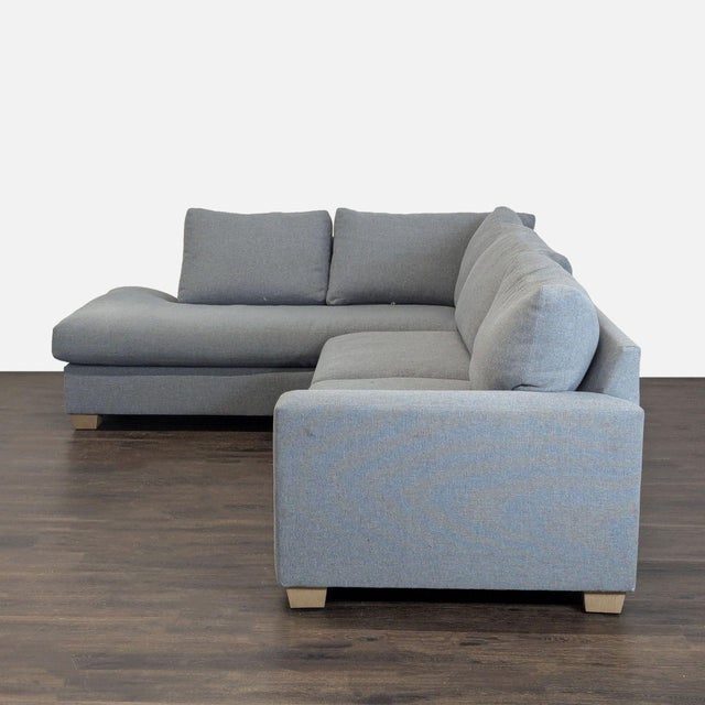 This Pottery Barn sectional offers spacious seating and features a sleek, modern design. Upholstered in soft, durable gray...