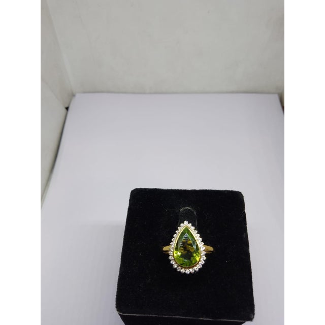 Gemstone details Gold Purity: 18K Solid Gold Peridot: 2.80 cts Diamond: 0.25 cts 18K gold Net weight: 3.14 grams code: k...
