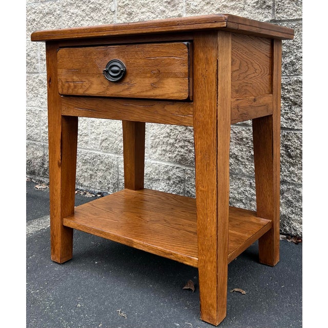 Great rustic oak farmhouse style side table by Broyhill from their Attic Heirlooms Collection. Single drawer with magazine...