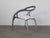 Silver powder coated magnesium frame, White polypropylene seat. This piece has an attribution mark, I am sure that it is...