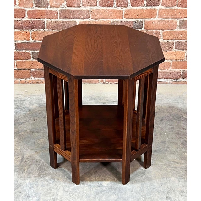 Handsome and highly functional, this vintage octagonal side table features clean Mission-style lines and a warm toned...