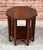 Handsome and highly functional, this vintage octagonal side table features clean Mission-style lines and a warm toned...