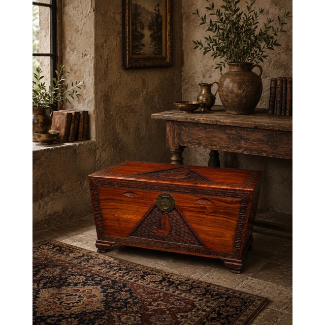 Rich in character and craftsmanship, this vintage hand-carved trunk showcases beautifully figured wood grain accented by...