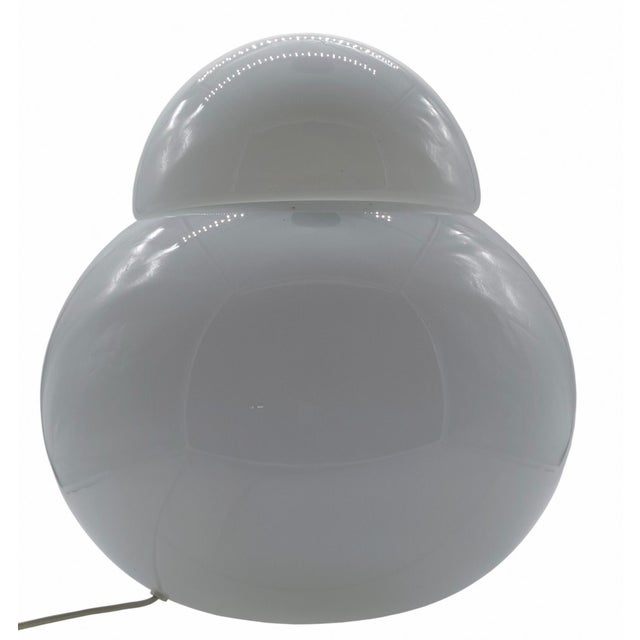 Large “Daruma” table lamp designed by Sergi Asti in 1969 for Fontana Arte, made from a spherical hand-blown opal glass...