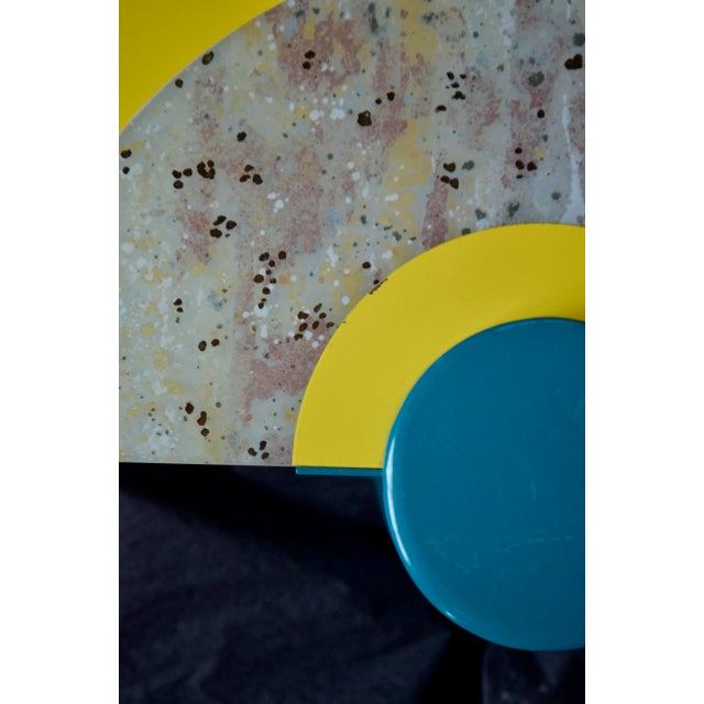 Rare suite of 4 wall lights from Arlus. French production from the 1980s. Multicolored and geometric design. In good...