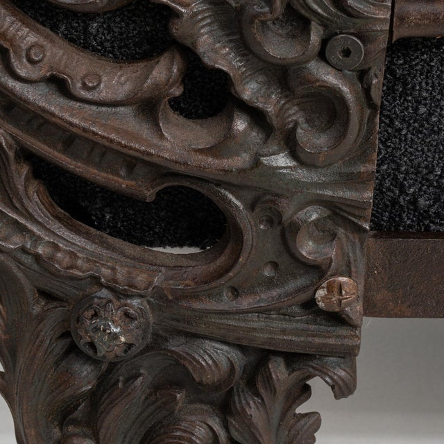 Carved daybed with upholstered bolsters in Deep Ebony Black. The deep ebony black surface highlights scroll-carved...
