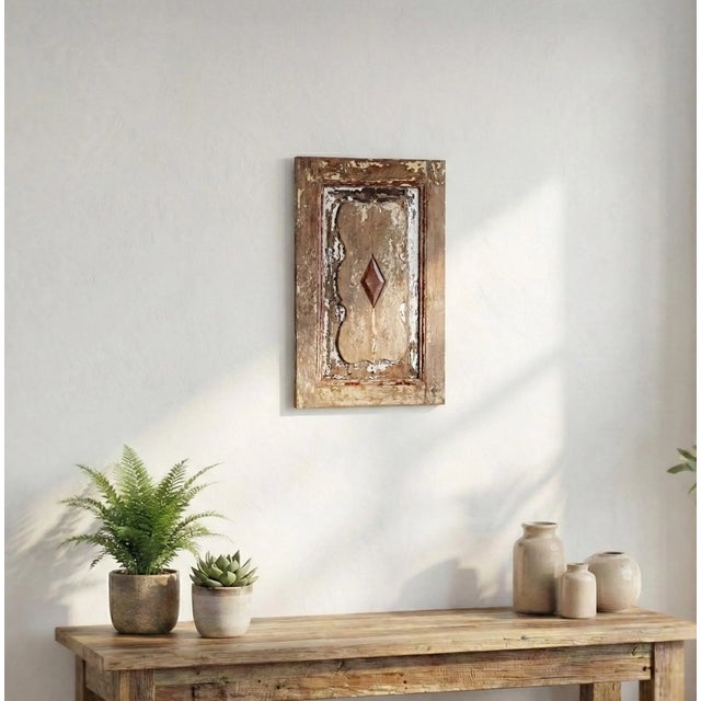 Dimensions: 13" W X 1" D X 21" H Add timeless charm to your space with this beautifully vintage carved wooden panel,...