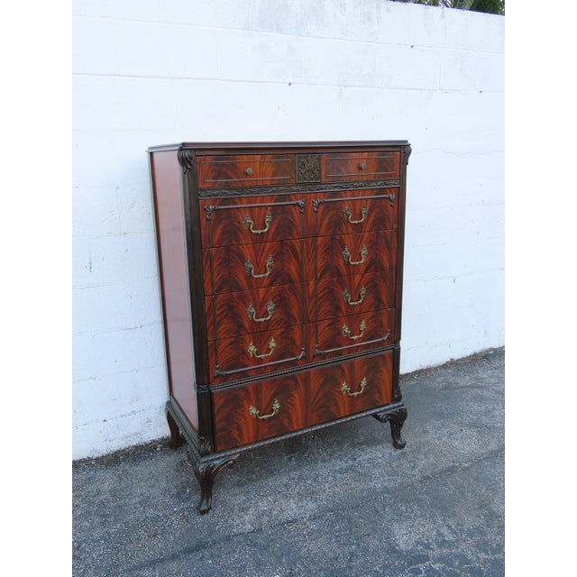 This classic Chest of Drawers is made out of wood, solid wood, mahogany, and flame mahogany veneer. This Chest of Drawers...