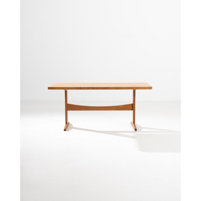 A Mid-Century Modernist twist on the classic trestle table, this vintage piece was built in Czechia in the mid 20th...