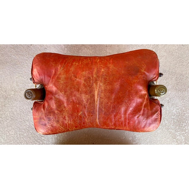 Vintage camel saddle from the 50's. Cushion lifts off and wood folds in half for storage by removing brass caps. My dad...