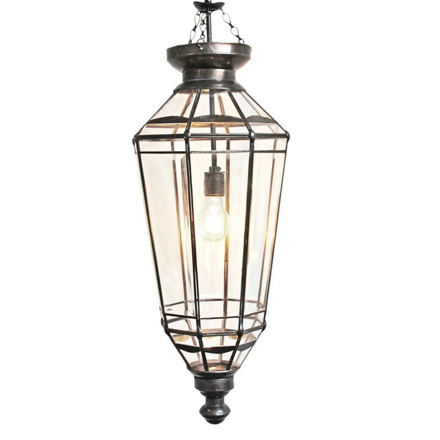 Bronzed metal work pendant lamp with beveled glass panels. Includes 3’ hanging chain and black ceiling plate. 100 watt max...