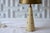 Vintage, mid-century modern accent lamp featuring gold cone shade atop an ivory leather lamp base with brass nail-heads....