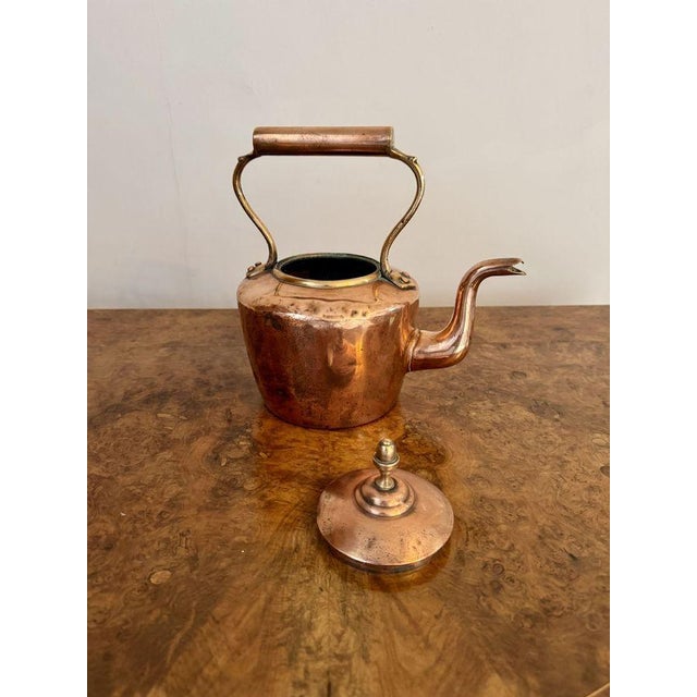 Antique George III small copper kettle, having a quality antique George III copper kettle with a removable lid with the...