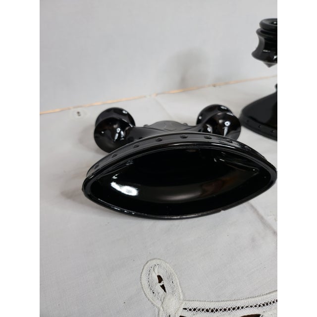 This pair of vintage L.E. Smith black amethyst glass double candleholders are in what is known as the Mount Pleasant...