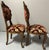 This pair of ornate, antique Italian Venetian-style side chairs (#2 of 3 available) feature extensive hand-carved details...