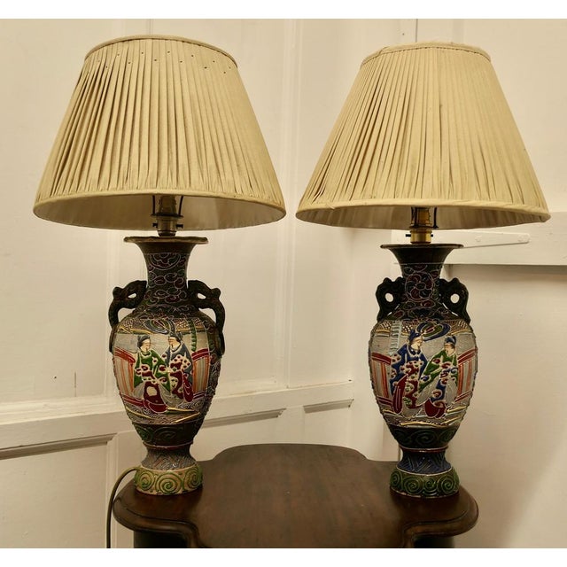 A Pair of Large Japanese Satsuma Lamps. A pair of large Japanese Moriage Satsuma Handpainted Lamps dating from the Early...