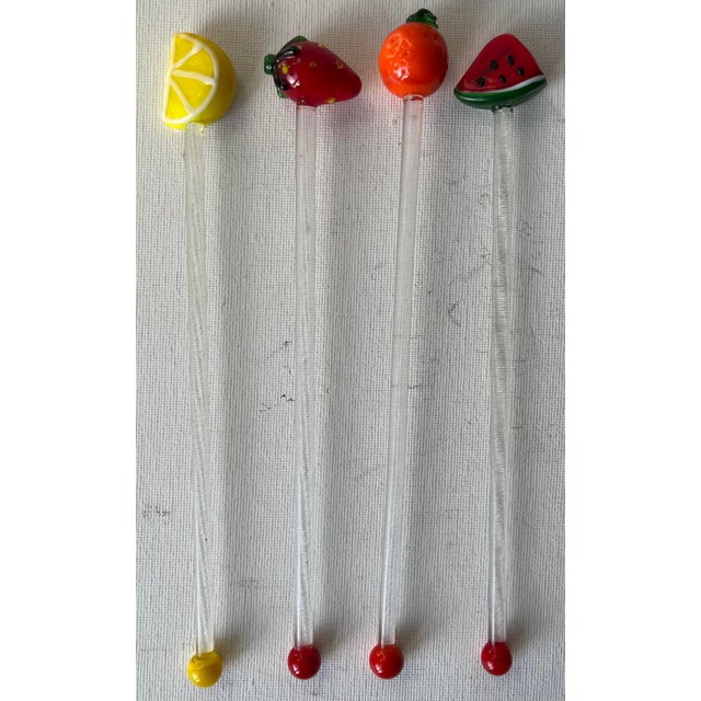 This whimsical set of 18 vintage blown glass swizzle sticks features 4 fruit sticks, 6 ice cream sundaes and 8 exotic...