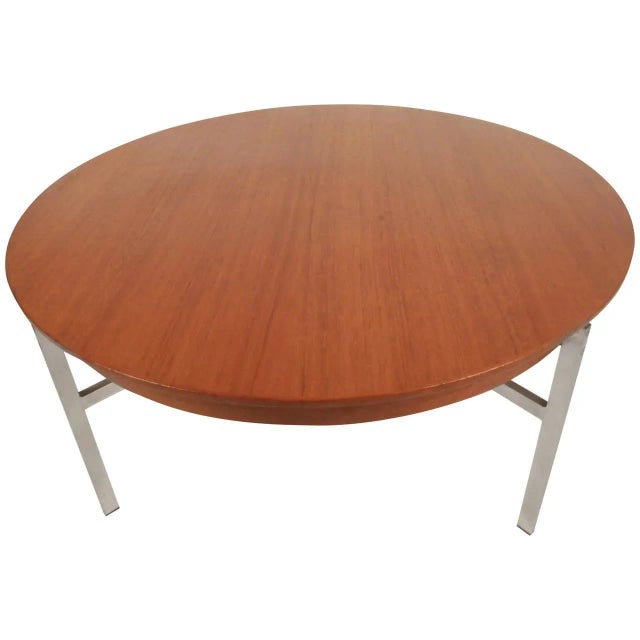 Vintage 1960s coffee table, features modern metal base and a round top with beautiful teak grain. SKU: 10678-7305RKc...