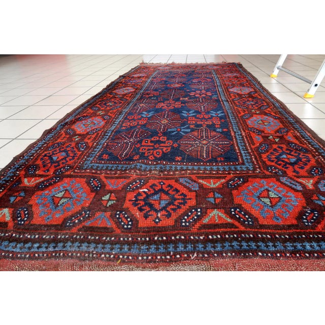 Handmade Antique Afghan Baluch Rug – 3.1' x 7.1' – 1880s Wool Runner Own a rare piece of history with this handmade...