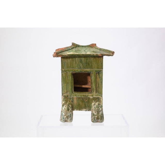 Ceramic house model (mingqi) dating to the Han period, circa 220 CE. This example was created as a tomb furnishing to...