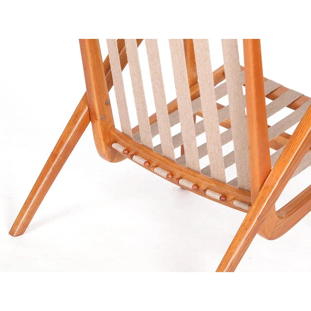 Wooden parts repainted, upholstery made of solid coconut fiber, the hemp straps added. Completely restored. Upholstered in...