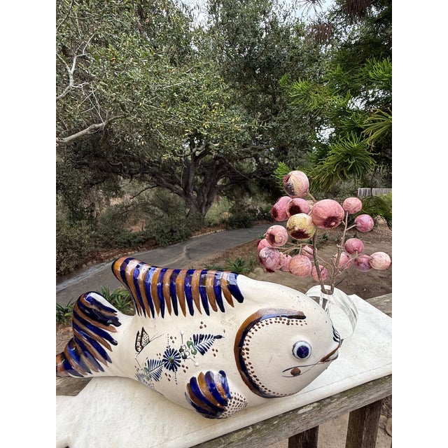 A vintage Tonalá Mexican folk art pottery fish sculpture, a highly collectible style of stoneware originating from...