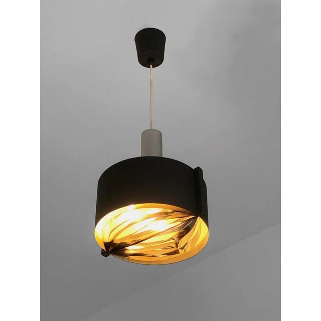 A small circular pendant light with optical effect and adjustable height, modernist, sixties, kinetic, constructivist,...