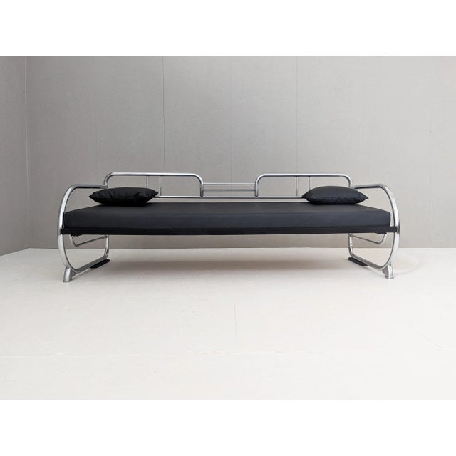 An iconic artifact of interwar functionalism, this rare Bauhaus tubular steel sofa was produced by Hynek Gottwald in...