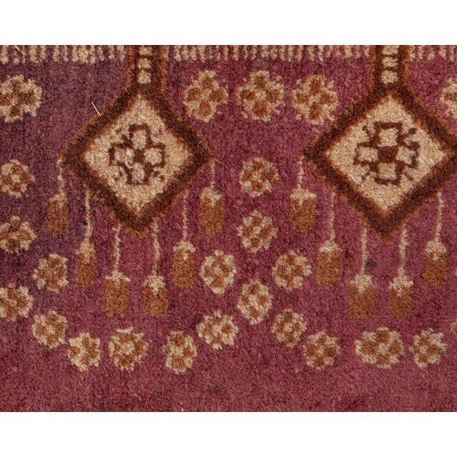 This antique Indian Amritsar rug exudes classic elegance with its rich, intricate design. Featuring delicate floral...