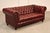 High Quality Tufted Red Leather Sofa or Loveseat with Brass Tack Trim, Mounted on Turned Feet