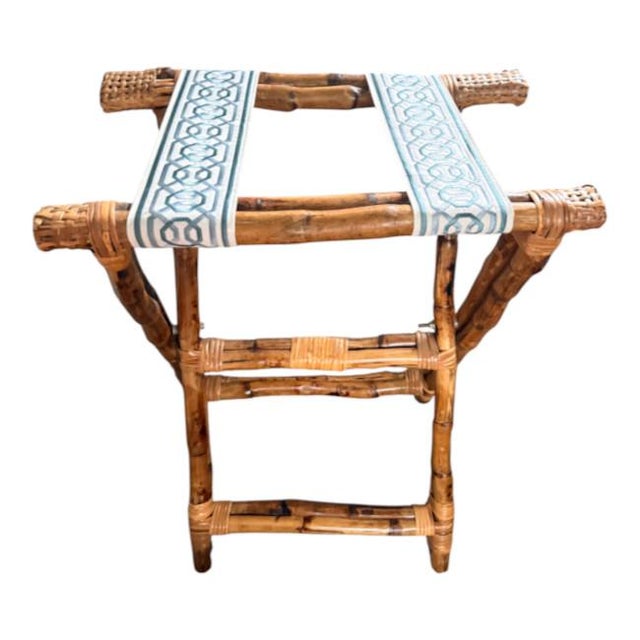 Charming vintage bamboo folding luggage rack featuring a warm, naturally aged bamboo frame with woven rattan details and...