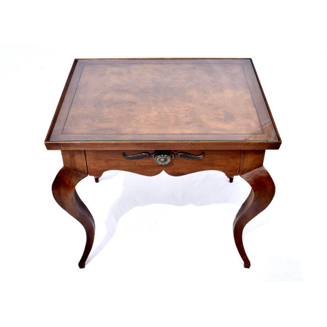 A simple and sophisticated Mid 20th Century French Louis XV style single-drawer nightstand or occasional side table of...