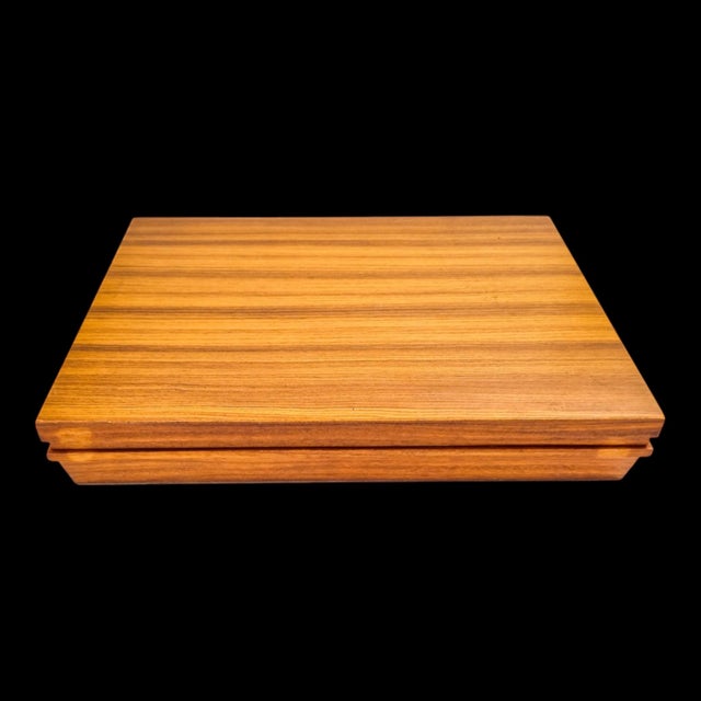 A complete vintage Oneida cutlery service for six in the decorative Flirtation pattern, presented in its original teak...