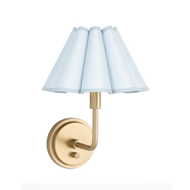 The Polly Wall Sconce brings an air of refined elegance with its single scalloped shade, casting a warm and comforting...