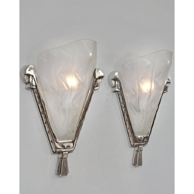 Degué A large pair of 1925-1935 French art deco wall sconces in nickel plated solid brass or bronze holding two beautiful...