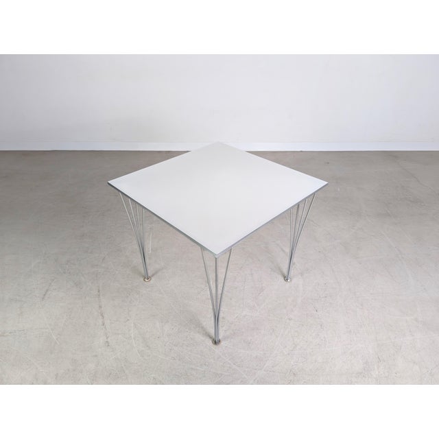 One of four original Fritz Hansen tables. Designed by Piet Hein, it is considered a true design classic. Condition: Good...