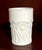 A vintage milk glass tumbler attributed to Indiana Glass Company, featuring their classic Star & Button style pressed...