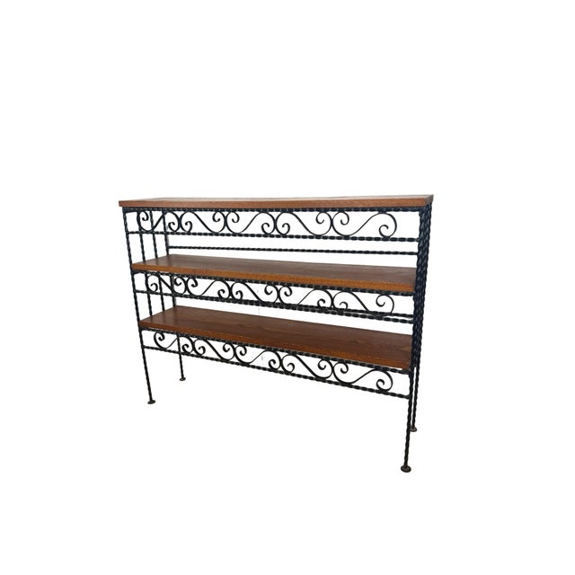 This is the kind of piece that makes a room feel collected rather than decorated. A striking wall-mounted shelf unit,...