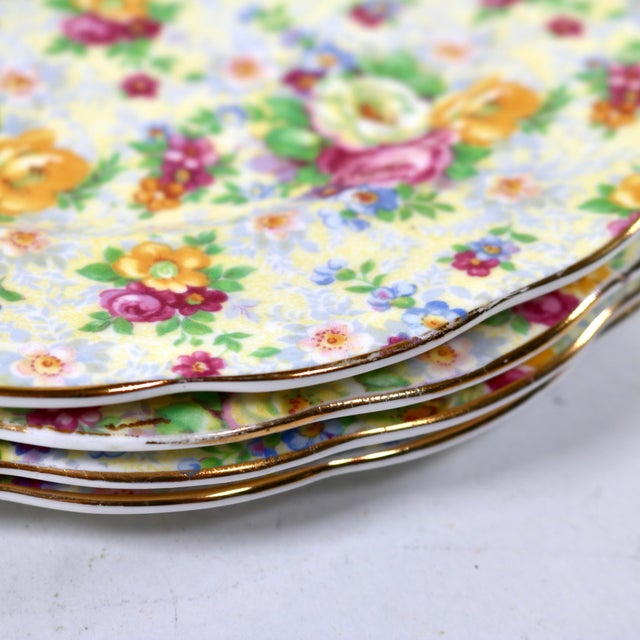 Beautiful dense, all*over design of white, yellow and pink roses complimented with a gold leaf border and scalloped edge....