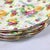Beautiful dense, all*over design of white, yellow and pink roses complimented with a gold leaf border and scalloped edge....