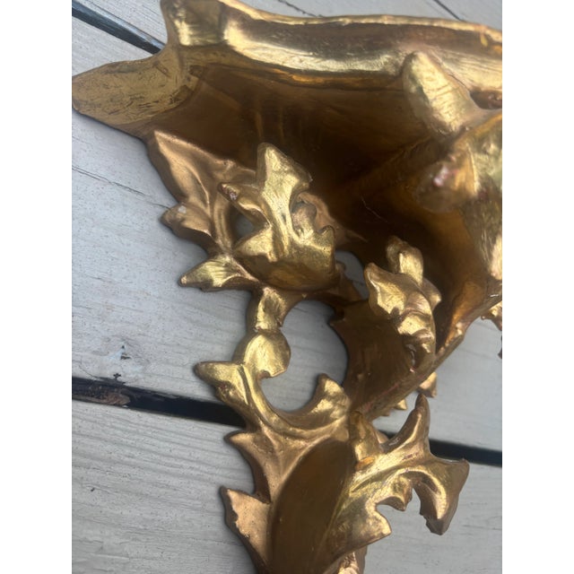 A beautiful single Italian gilt wood rococo wall bracket, intricately carved, gessoed and gilt, probably dating from the...