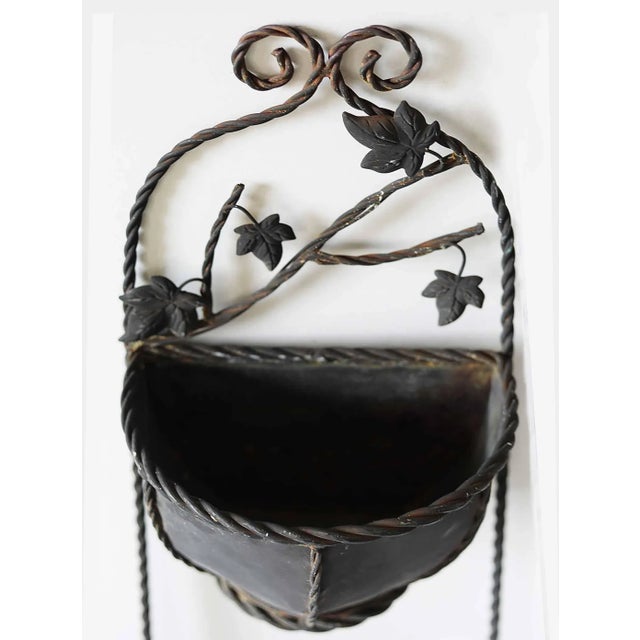 Pair of vintage large double wall pockets with branch and leaf design. Iron and copper with aged patina.