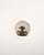 Patinated metal wall light with a female figure and ornamental scroll motifs, complemented by a circular frosted glass...