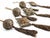 An elegant set of six decorative Christmas ornaments in a sophisticated palette of antique gold, taupe, bronze, and soft...