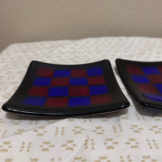Add a colorful touch to your space with this set of two fused glass checkered trinket dishes. These small decorative...