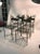 An outstanding set of four iron outdoor garden chairs with X-base and lovely leaf design in the manner of Claude Lalanne,...