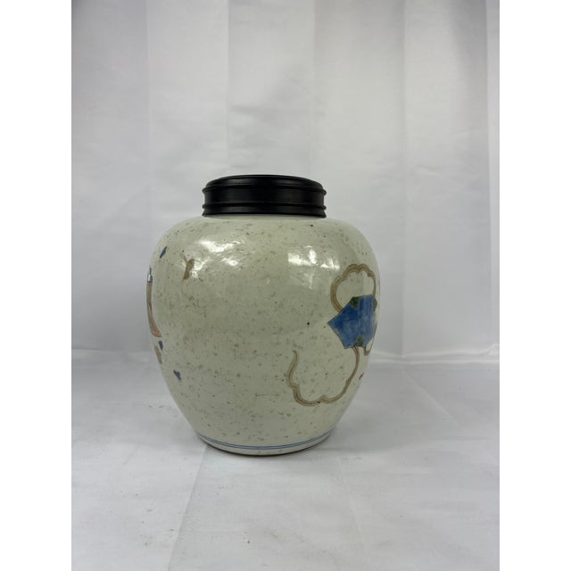 This Antique Chinese porcelain jar exemplifies fine craftsmanship and artistic elegance. The piece is adorned with vibrant...