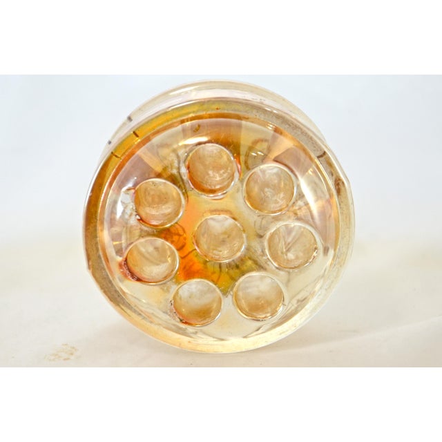 Iridescent peach glass paper weight pen holder. Made to be a flower frog for stemmed flower arrangements but looks...