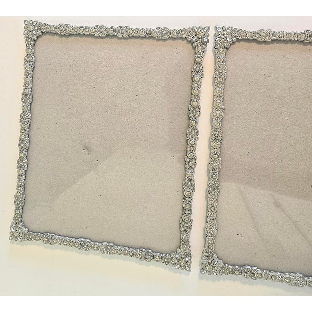 Bada-bing with ALL the bling! This is a pair of heavily encrusted art nouveau frames. They hold an 8x 10 picture and have...